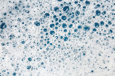 Photo of Detergent foam with bubbles as background, top view