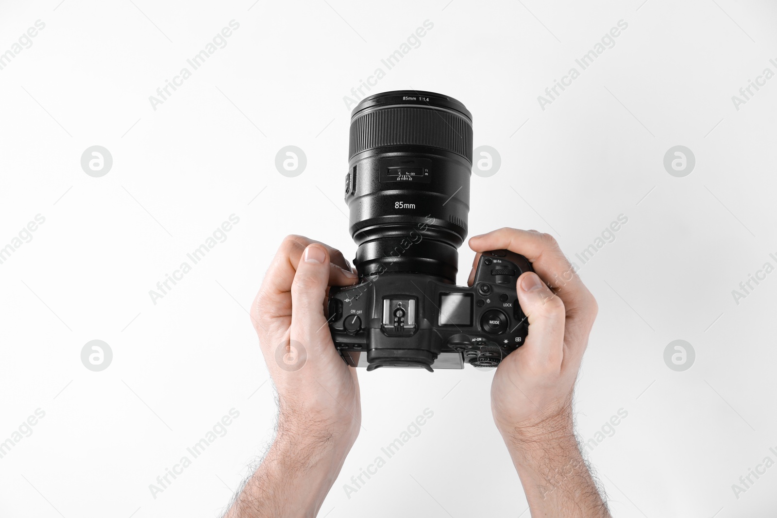 Photo of Photographer with professional camera on white background, closeup