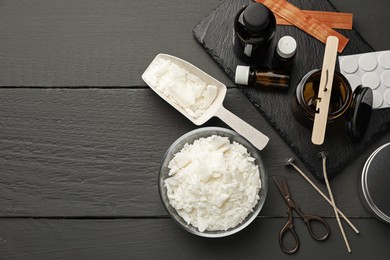 Photo of Soy wax, essential oils and different tools for making candles on grey wooden table, flat lay. Space for text