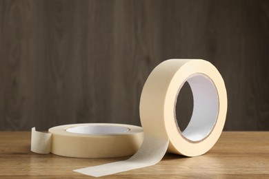 Rolls of masking tape on wooden table