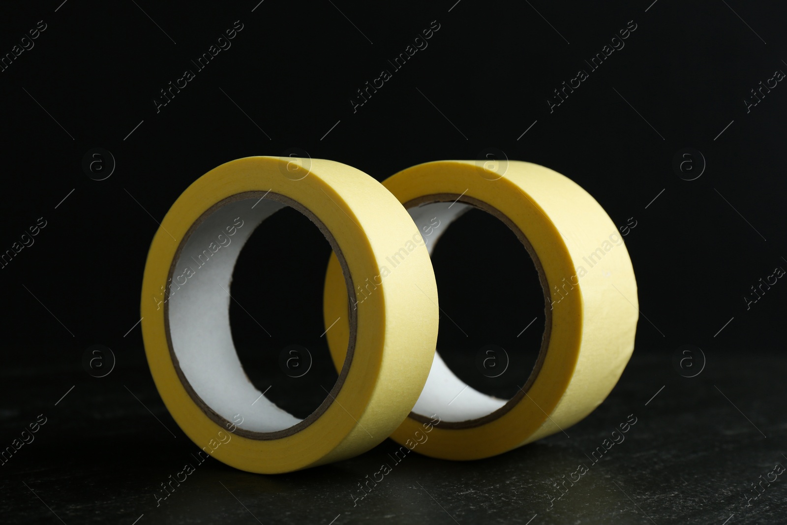 Photo of Rolls of masking tape on black table