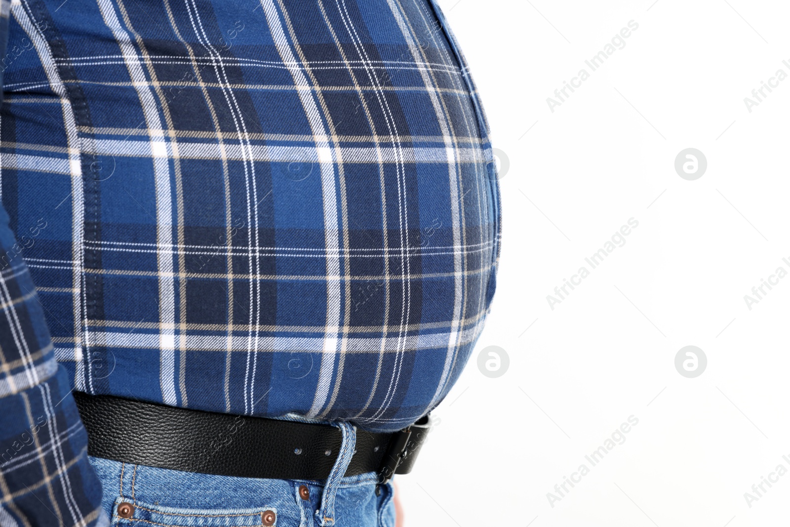 Photo of Overweight man in tight shirt on white background, closeup. Space for text