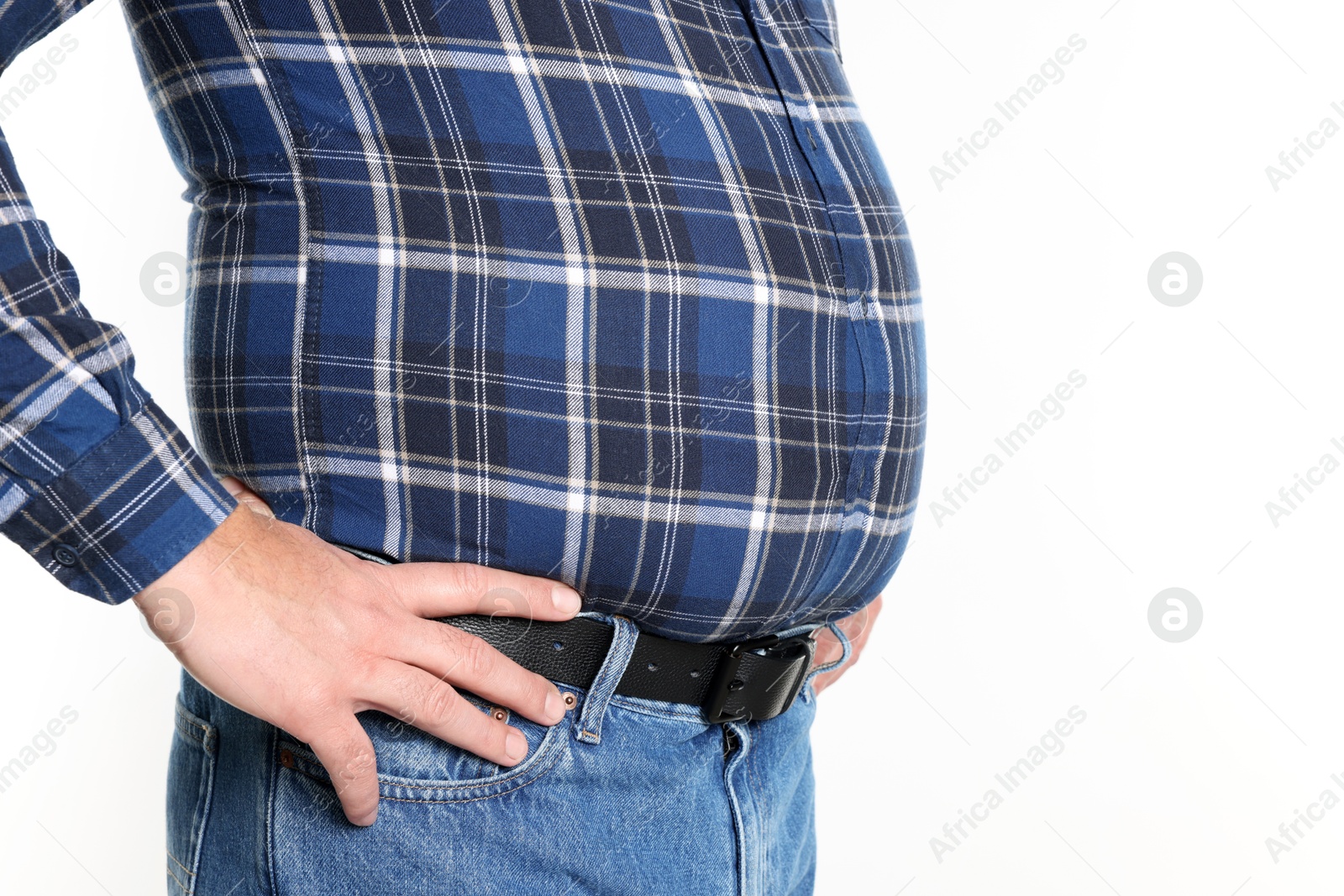 Photo of Overweight man in tight shirt on white background, closeup. Space for text