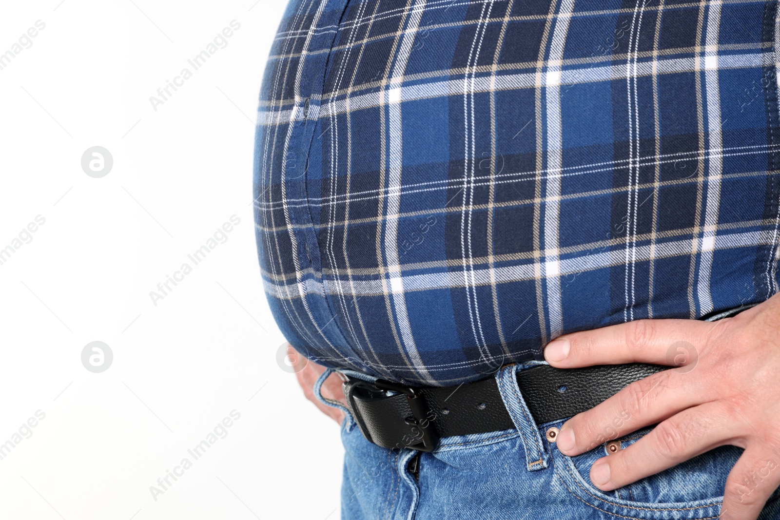 Photo of Overweight man in tight shirt on white background, closeup. Space for text