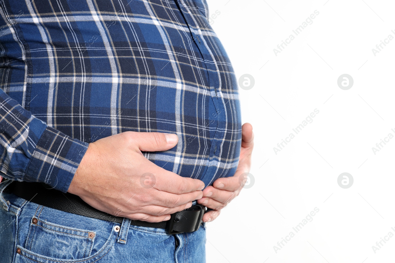 Photo of Overweight man in tight shirt on white background, closeup. Space for text