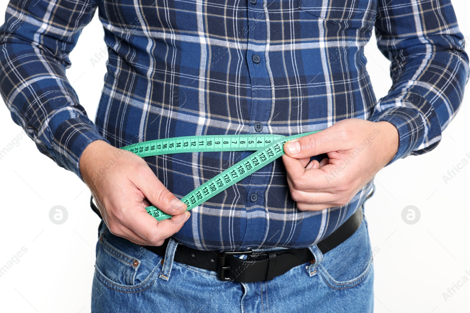 Photo of Overweight man measuring his belly with tape on white background, closeup