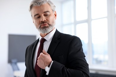 Photo of Portrait of banker in jacket at workplace