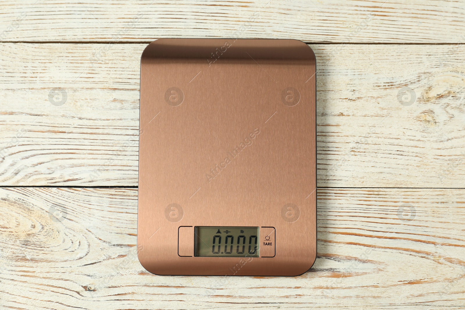 Photo of Modern electronic kitchen scale on wooden table, top view