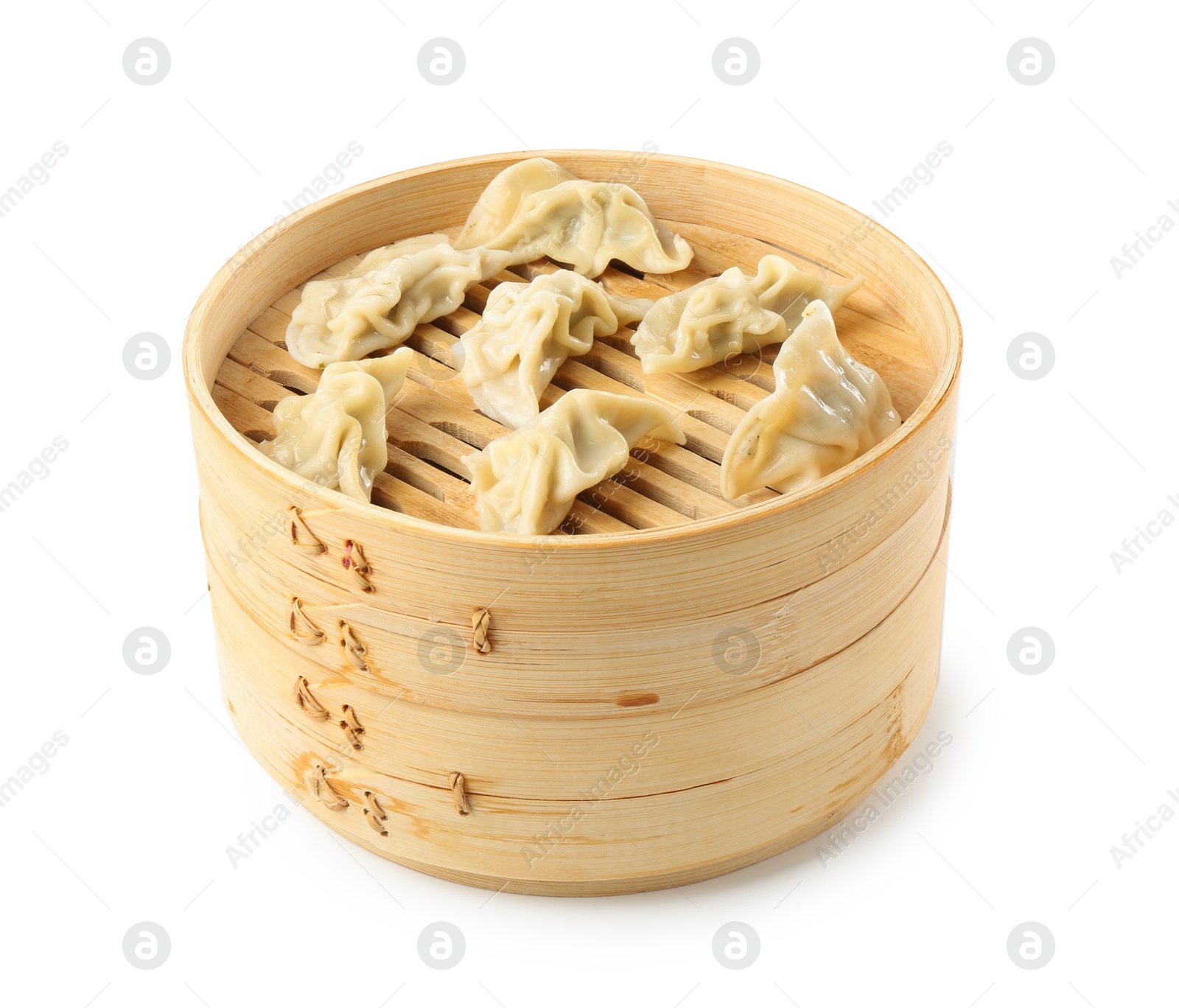 Photo of Tasty boiled gyoza (dumplings) in bamboo steamer isolated on white