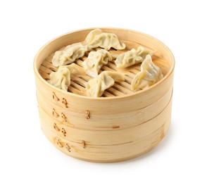 Photo of Tasty boiled gyoza (dumplings) in bamboo steamer isolated on white