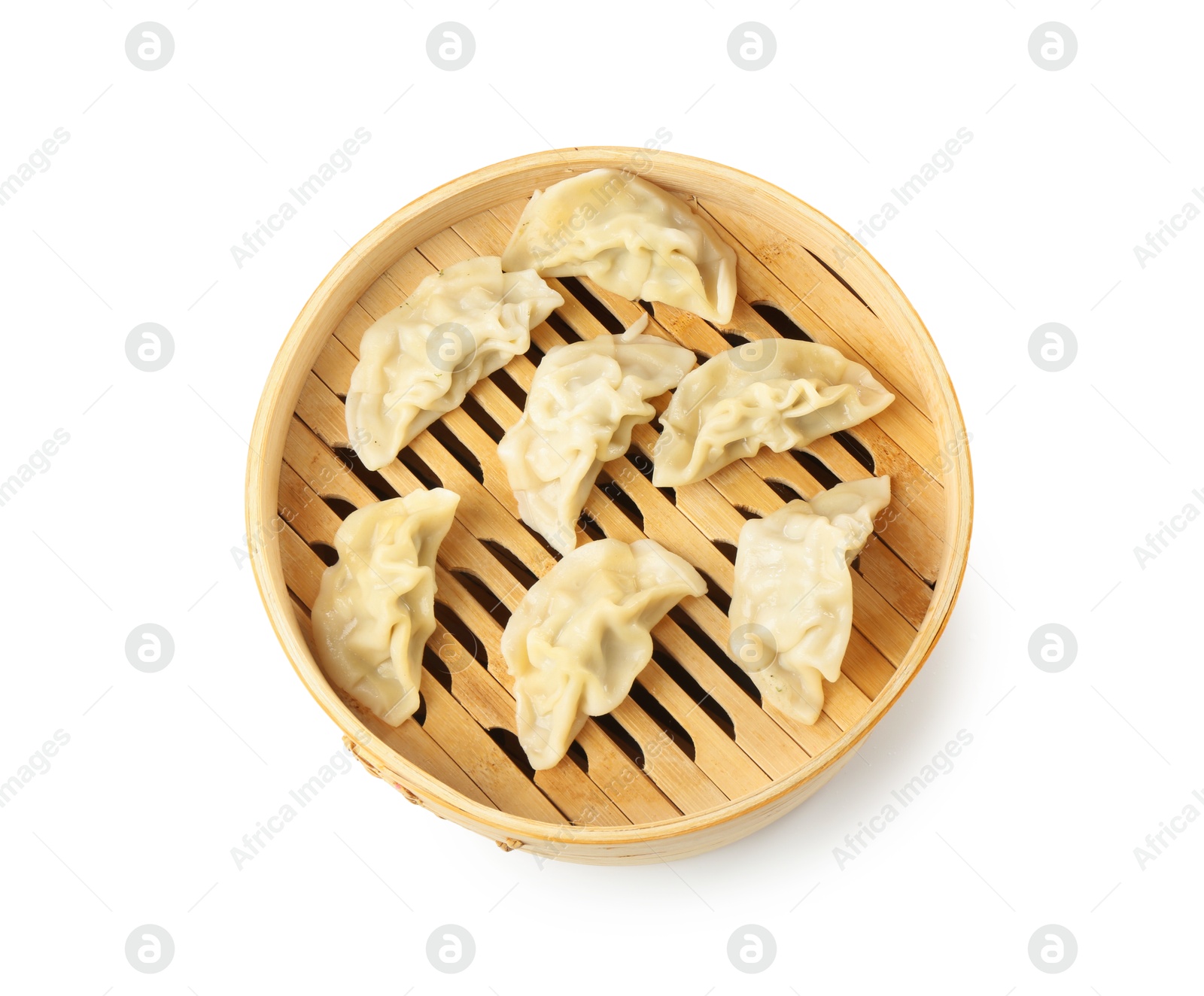 Photo of Tasty boiled gyoza (dumplings) in bamboo steamer isolated on white, top view