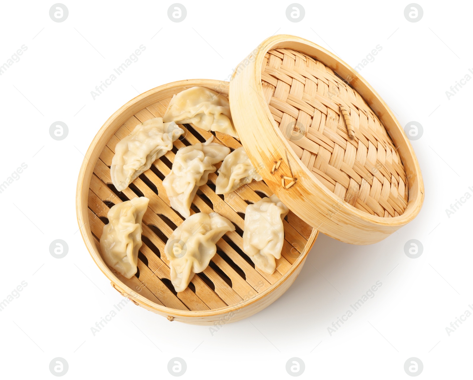 Photo of Tasty boiled gyoza (dumplings) in bamboo steamer isolated on white, top view