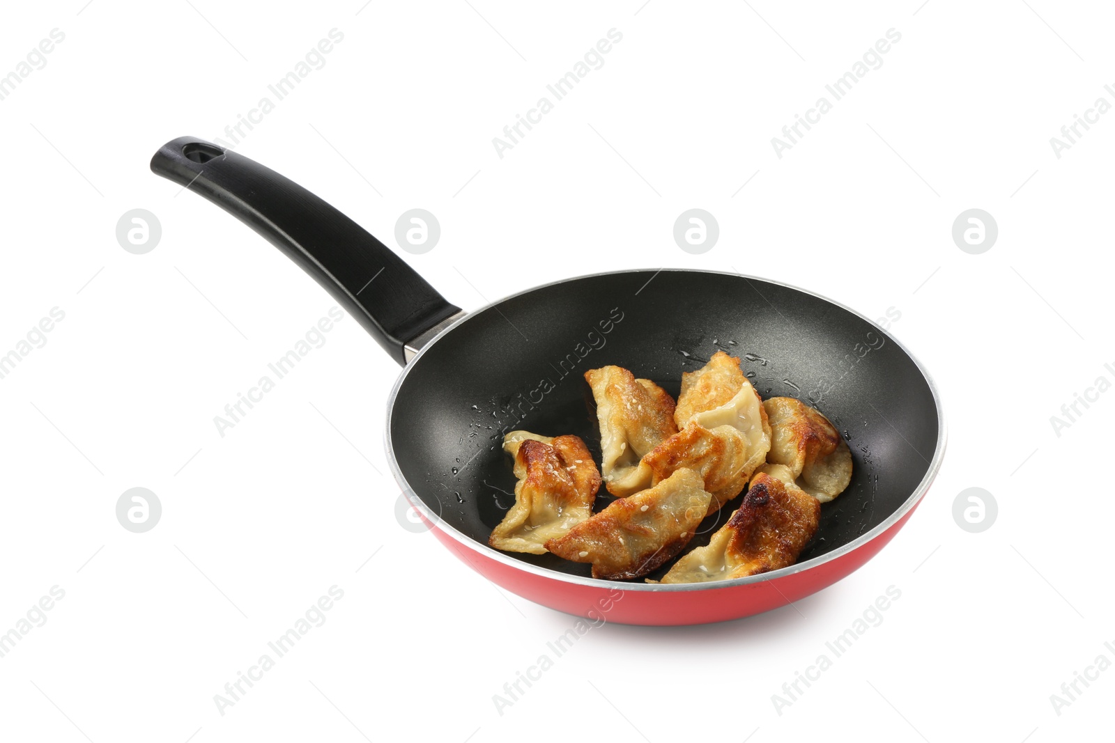 Photo of Tasty fried gyoza (dumplings) in frying pan isolated on white