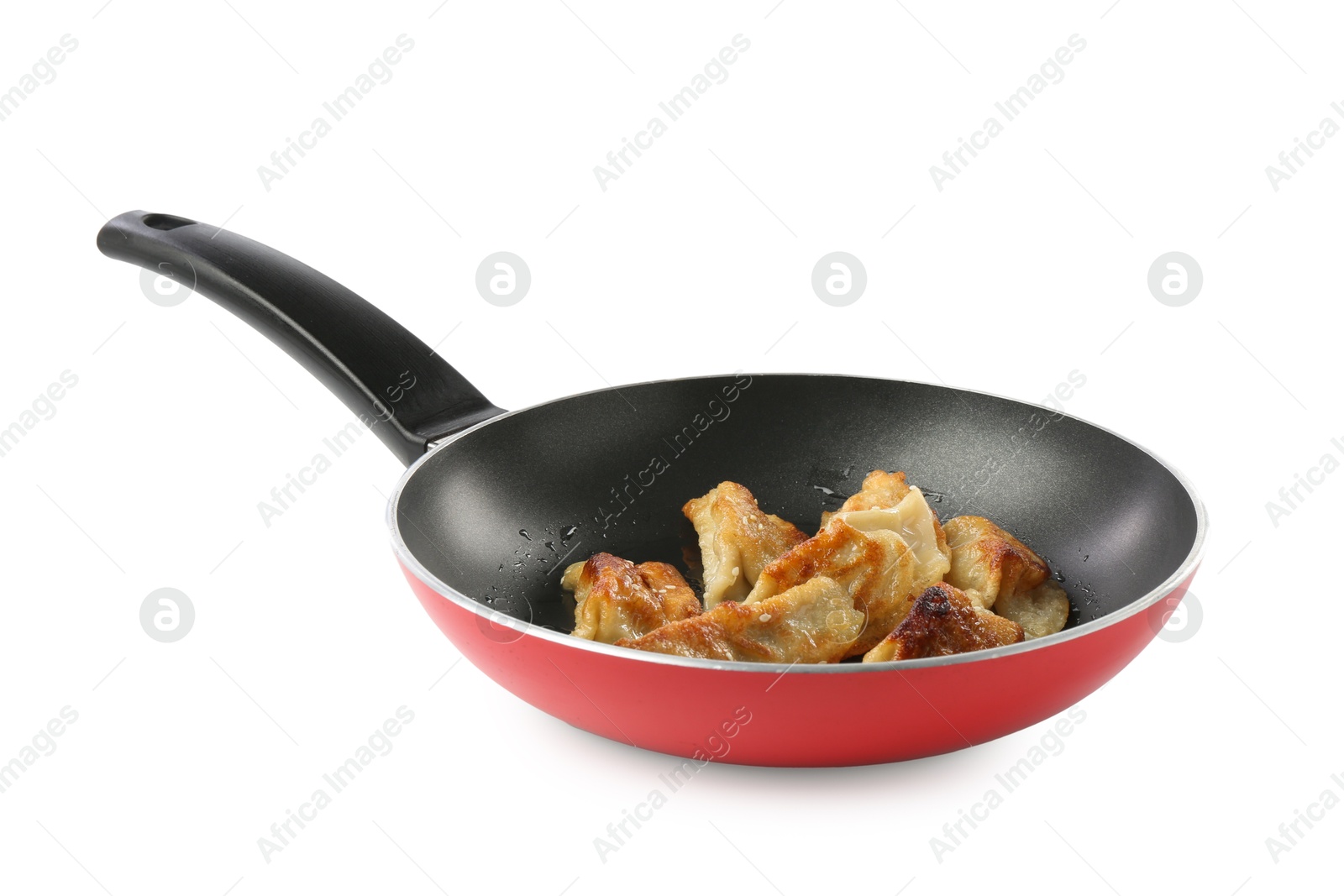 Photo of Tasty fried gyoza (dumplings) in frying pan isolated on white