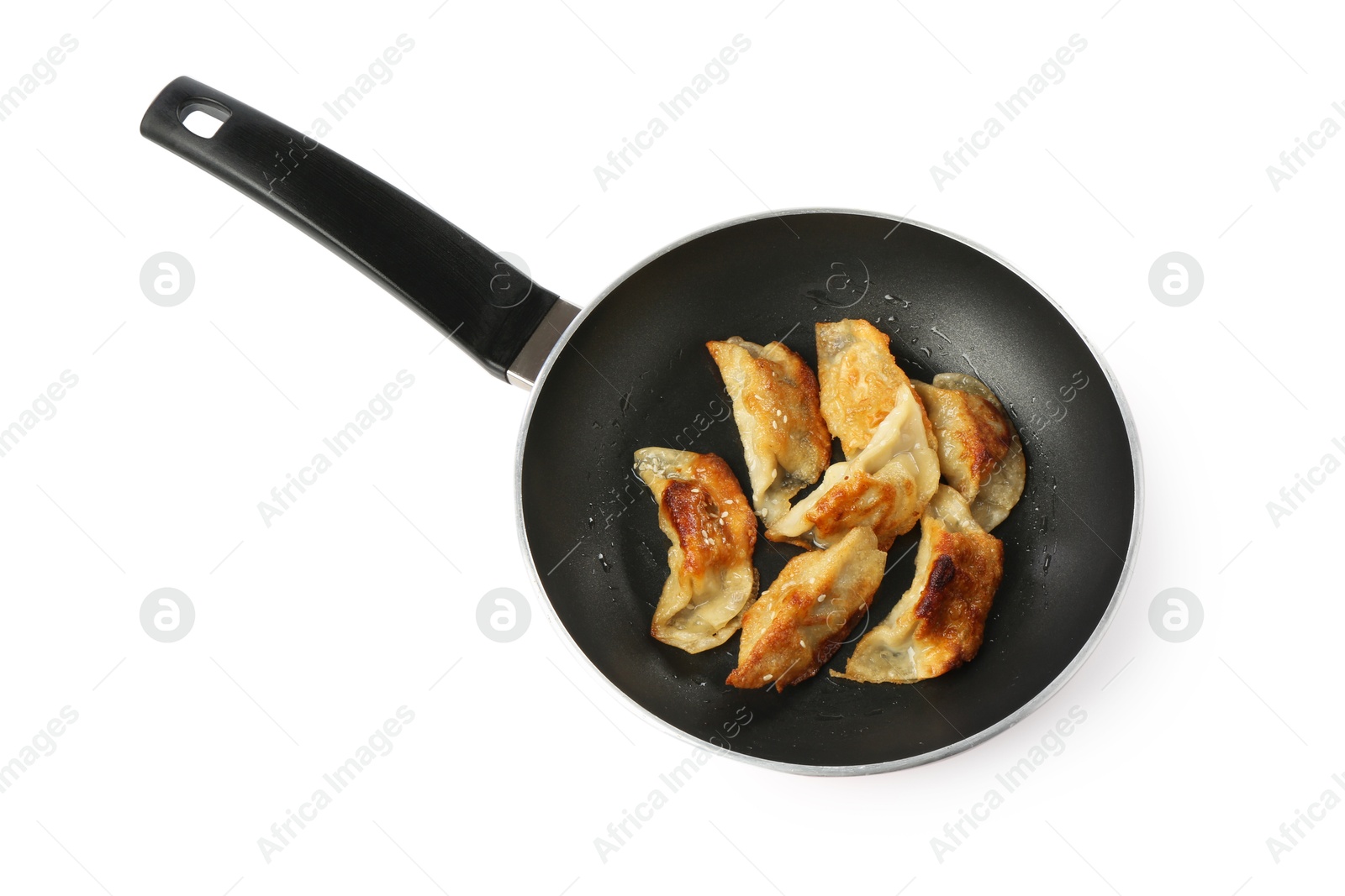 Photo of Tasty fried gyoza (dumplings) in frying pan isolated on white