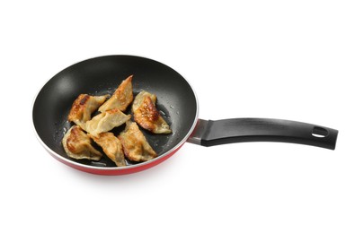 Photo of Tasty fried gyoza (dumplings) in frying pan isolated on white