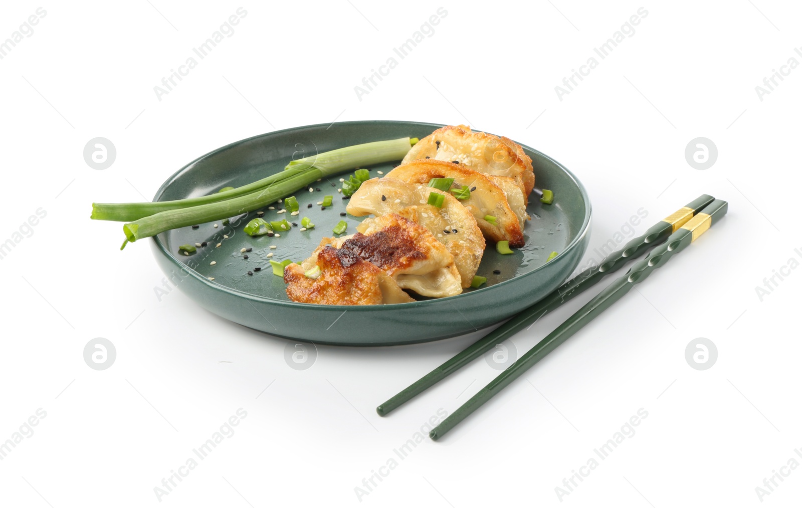 Photo of Tasty fried gyoza (dumplings), onion and chopsticks isolated on white