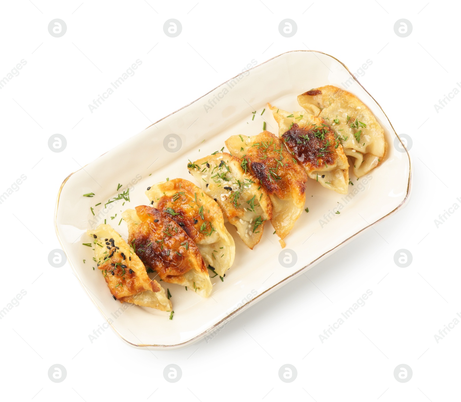 Photo of Tasty fried gyoza (dumplings) isolated on white, top view