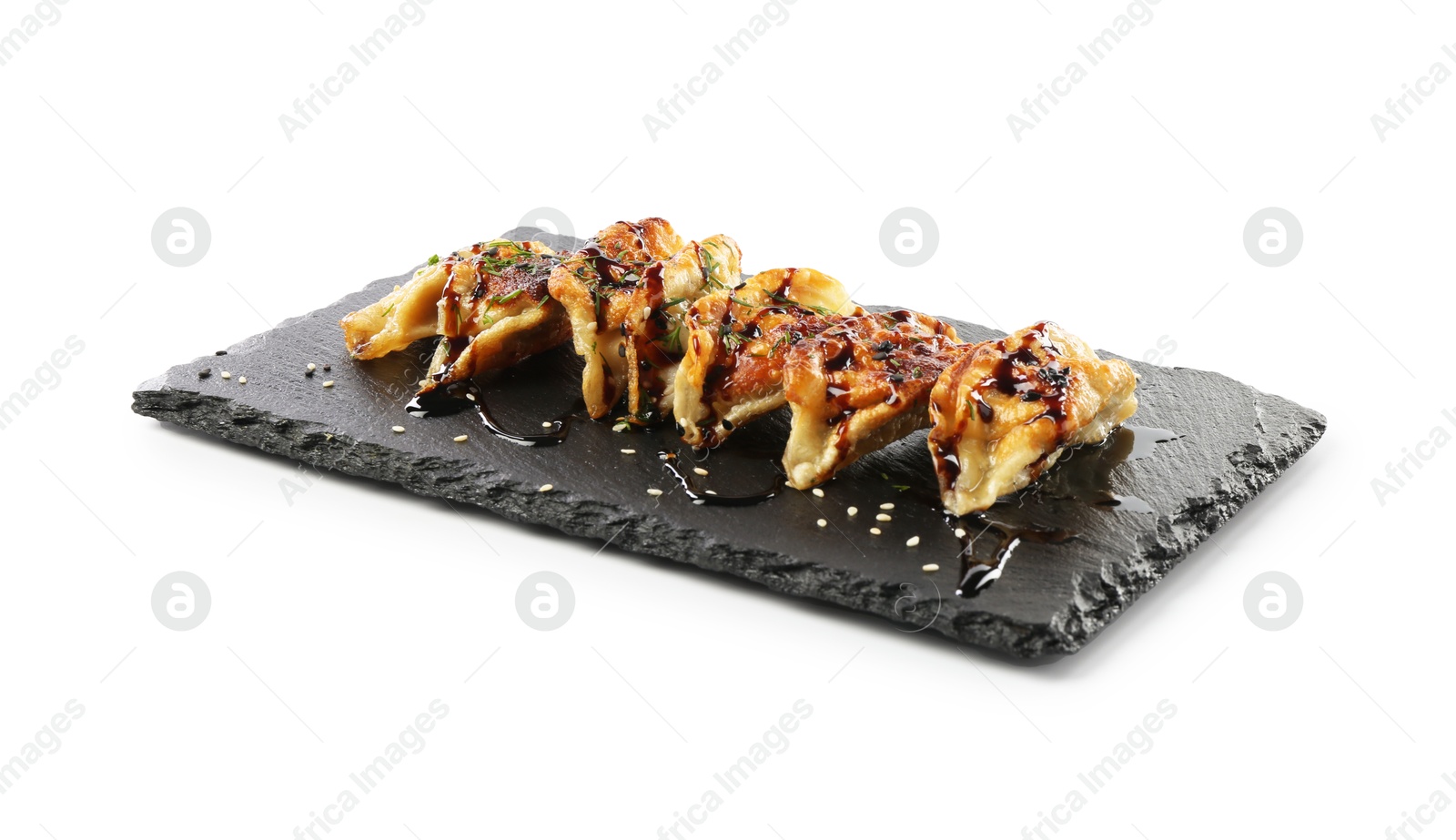 Photo of Tasty fried gyoza (dumplings) isolated on white