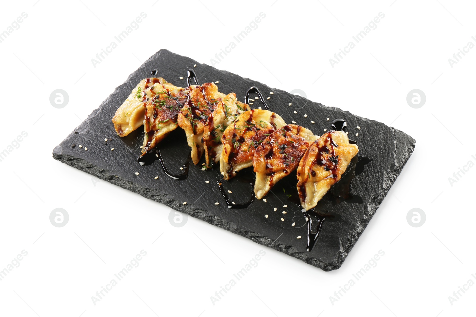 Photo of Tasty fried gyoza (dumplings) isolated on white