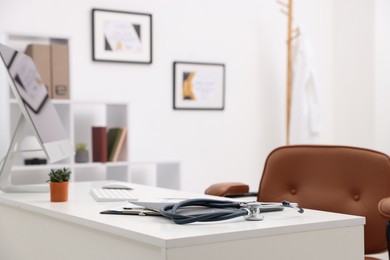 Photo of Doctor's workplace with computer in medical office