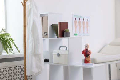 Photo of Doctor's coat on rack in medical office