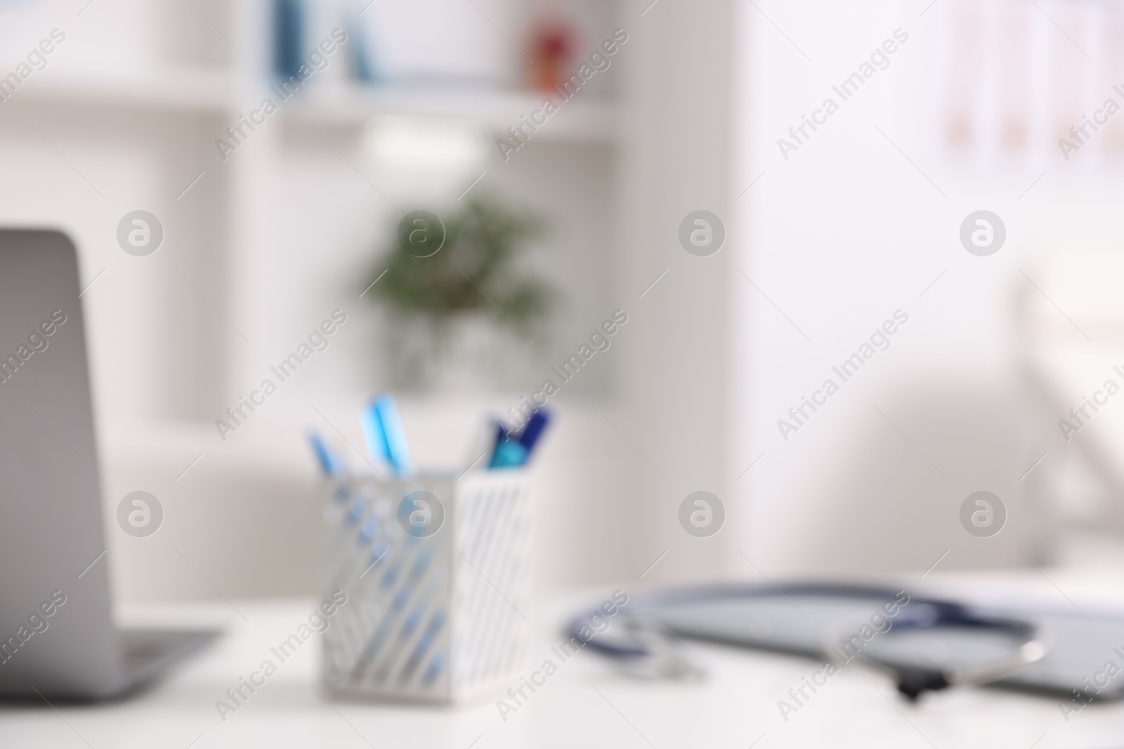 Photo of Blurred view of doctor's workplace in medical office, closeup