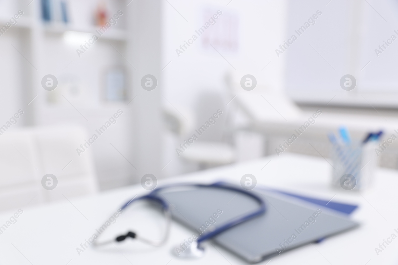 Photo of Blurred view of doctor's workplace in medical office, closeup