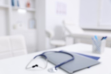 Photo of Blurred view of doctor's workplace in medical office, closeup