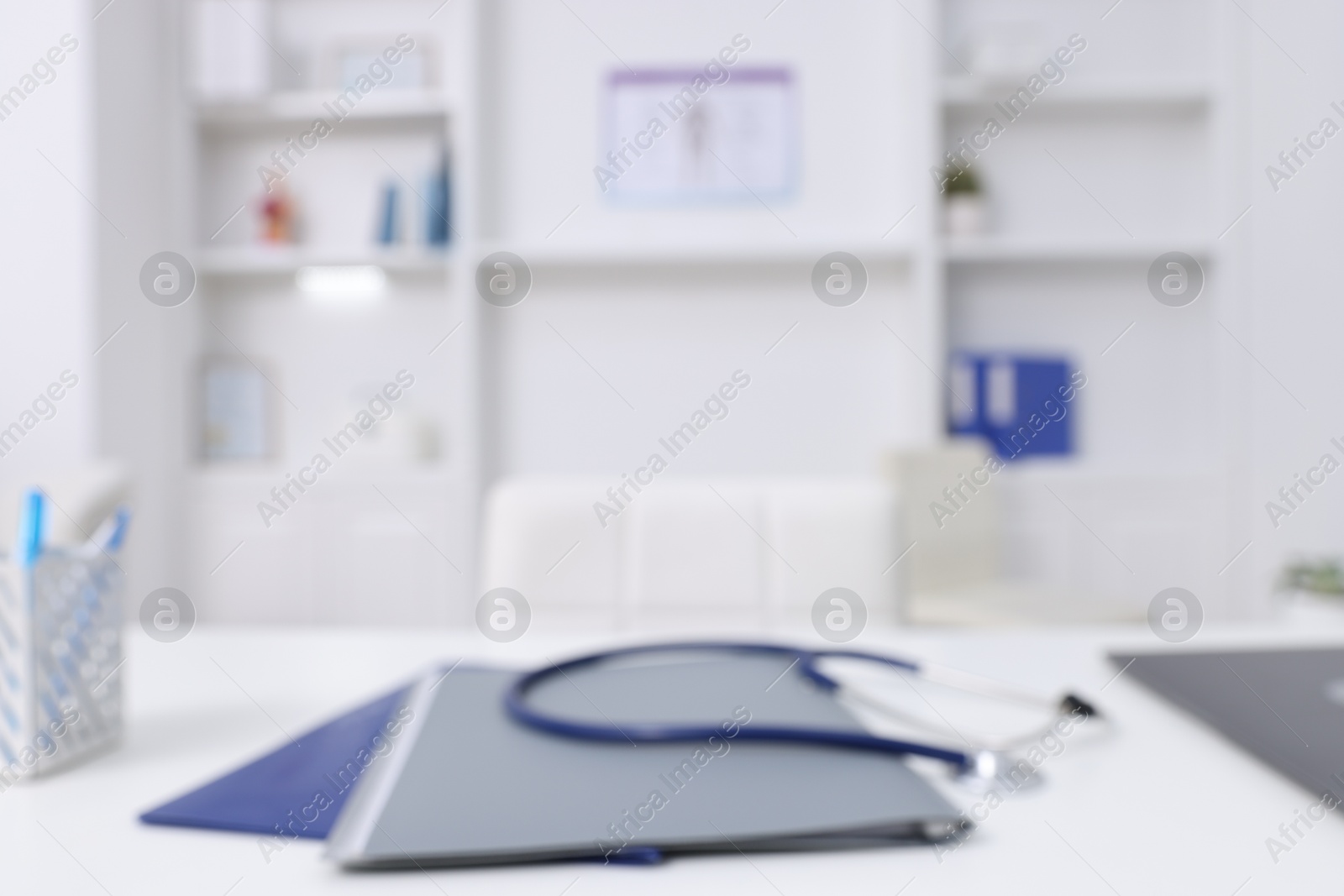 Photo of Blurred view of doctor's workplace in medical office, closeup