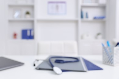 Photo of Blurred view of doctor's workplace in medical office, closeup