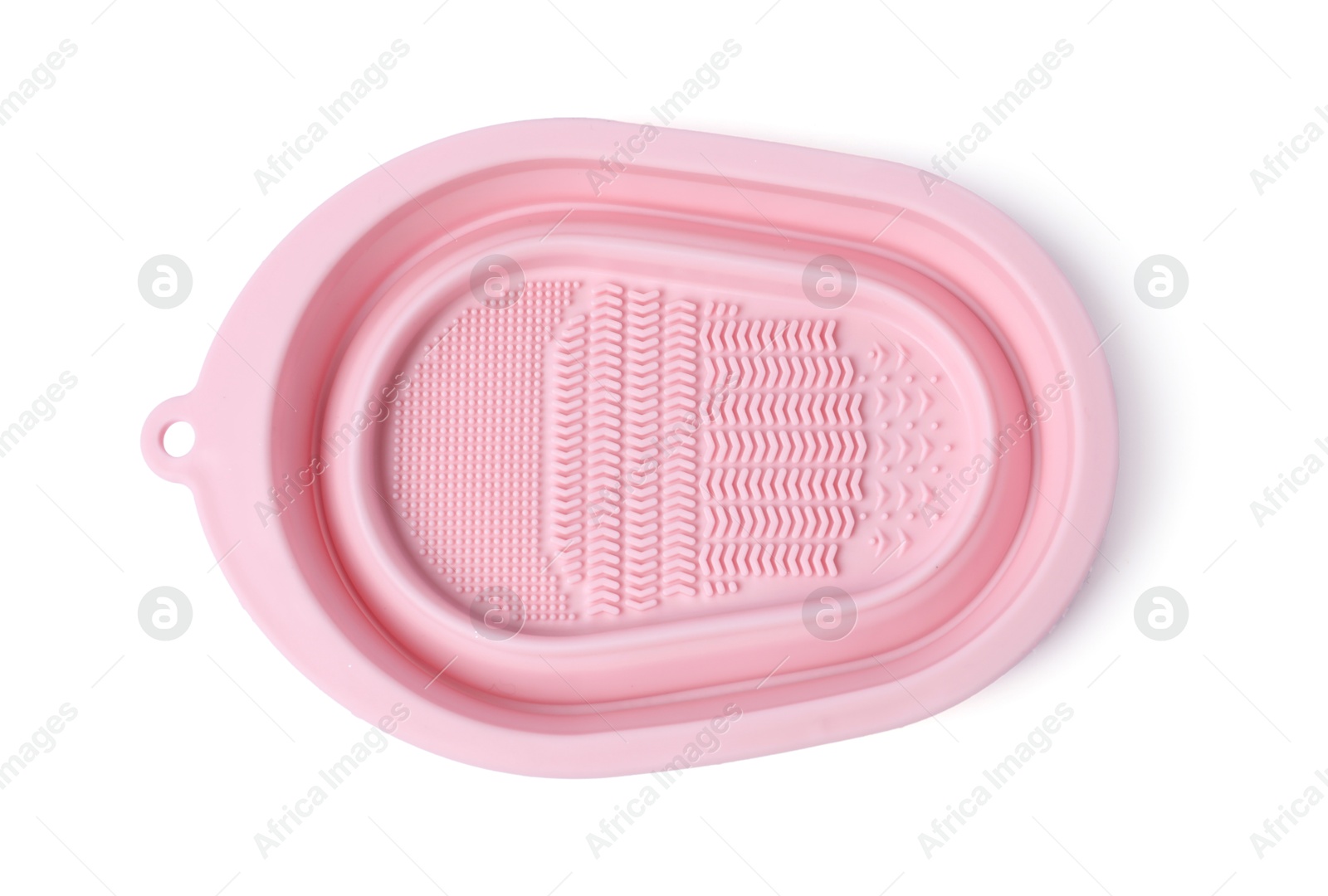 Photo of Silicone pad for cleaning makeup brushes isolated on white, top view