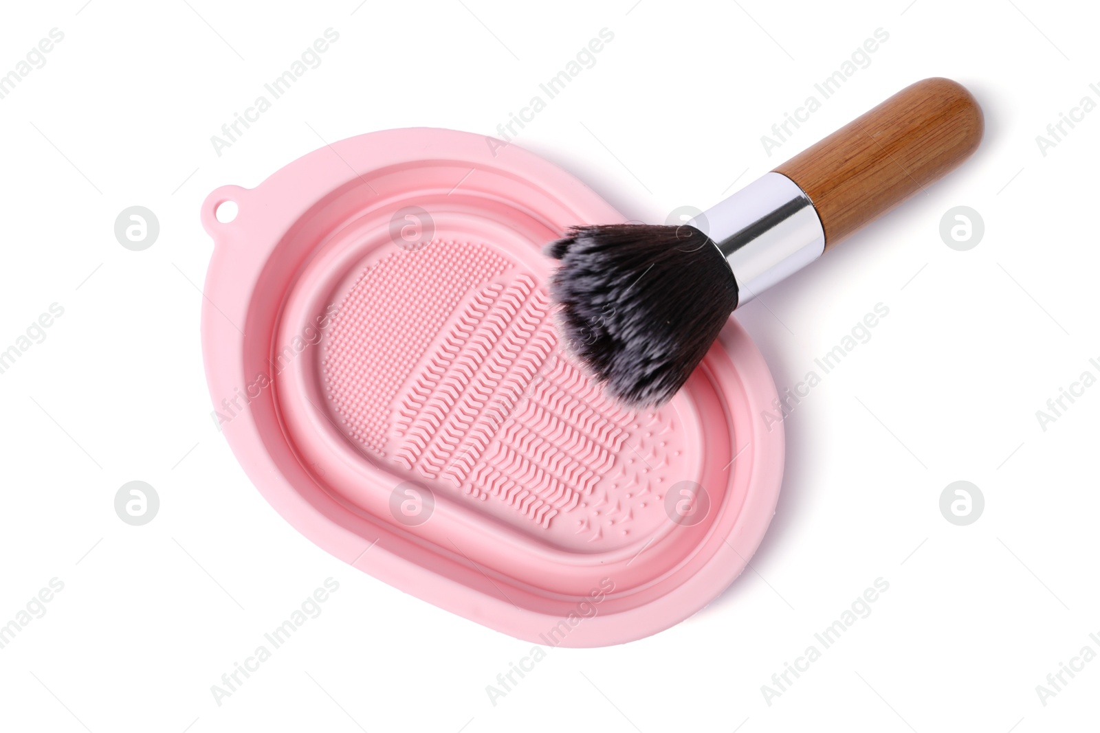 Photo of Makeup brush and cleansing pad isolated on white, top view