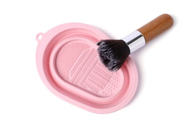 Photo of Makeup brush and cleansing pad isolated on white, top view