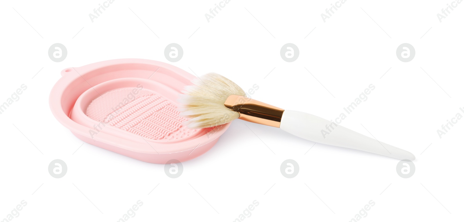 Photo of Makeup brush and cleansing pad isolated on white