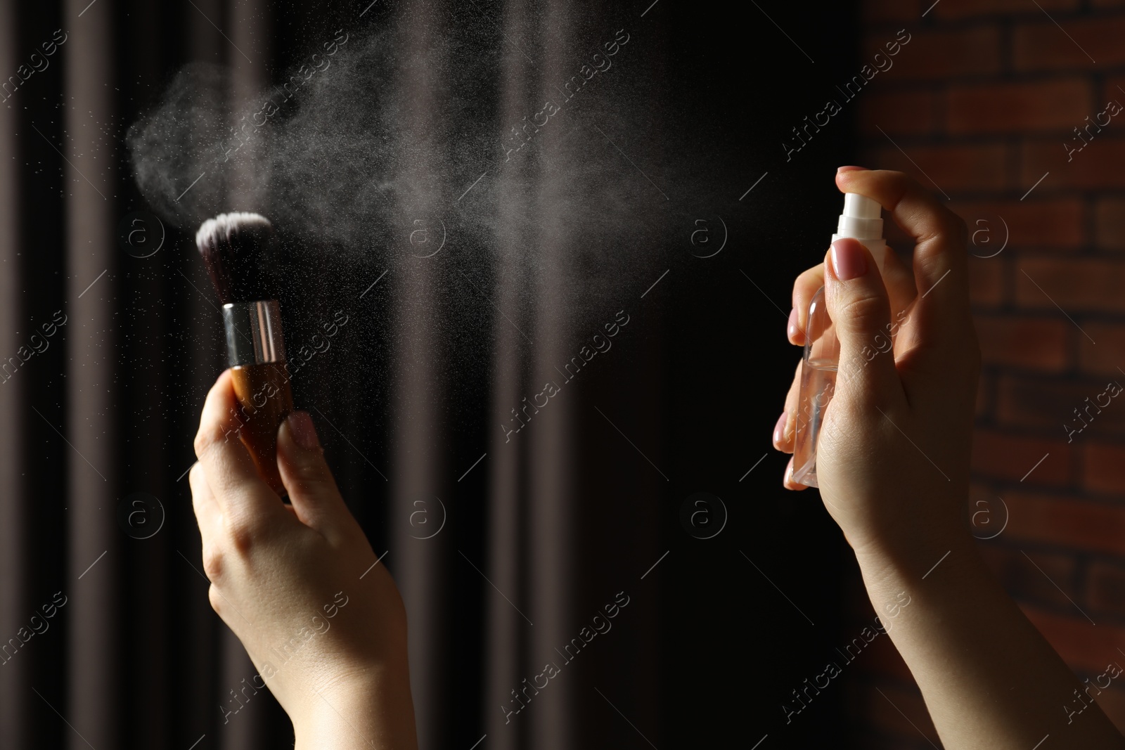 Photo of Woman cleaning makeup brush with spray indoors, closeup