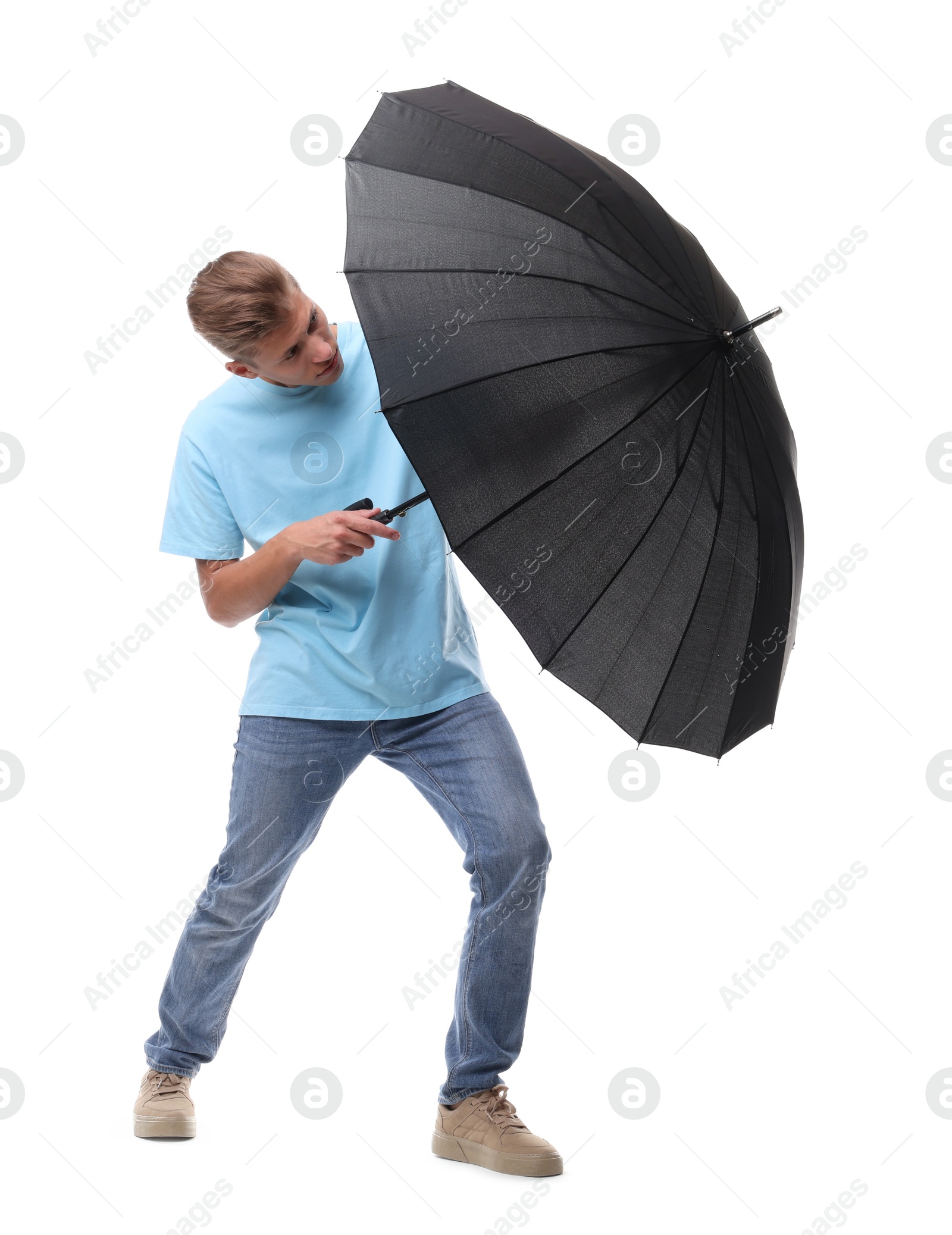 Photo of Man with black umbrella on white background