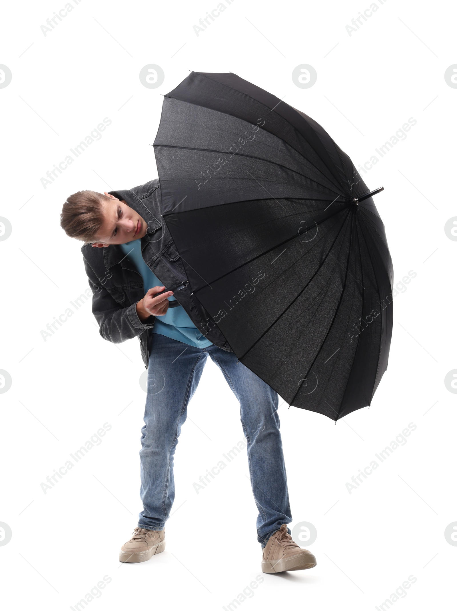 Photo of Man with black umbrella on white background