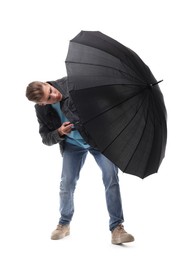 Photo of Man with black umbrella on white background