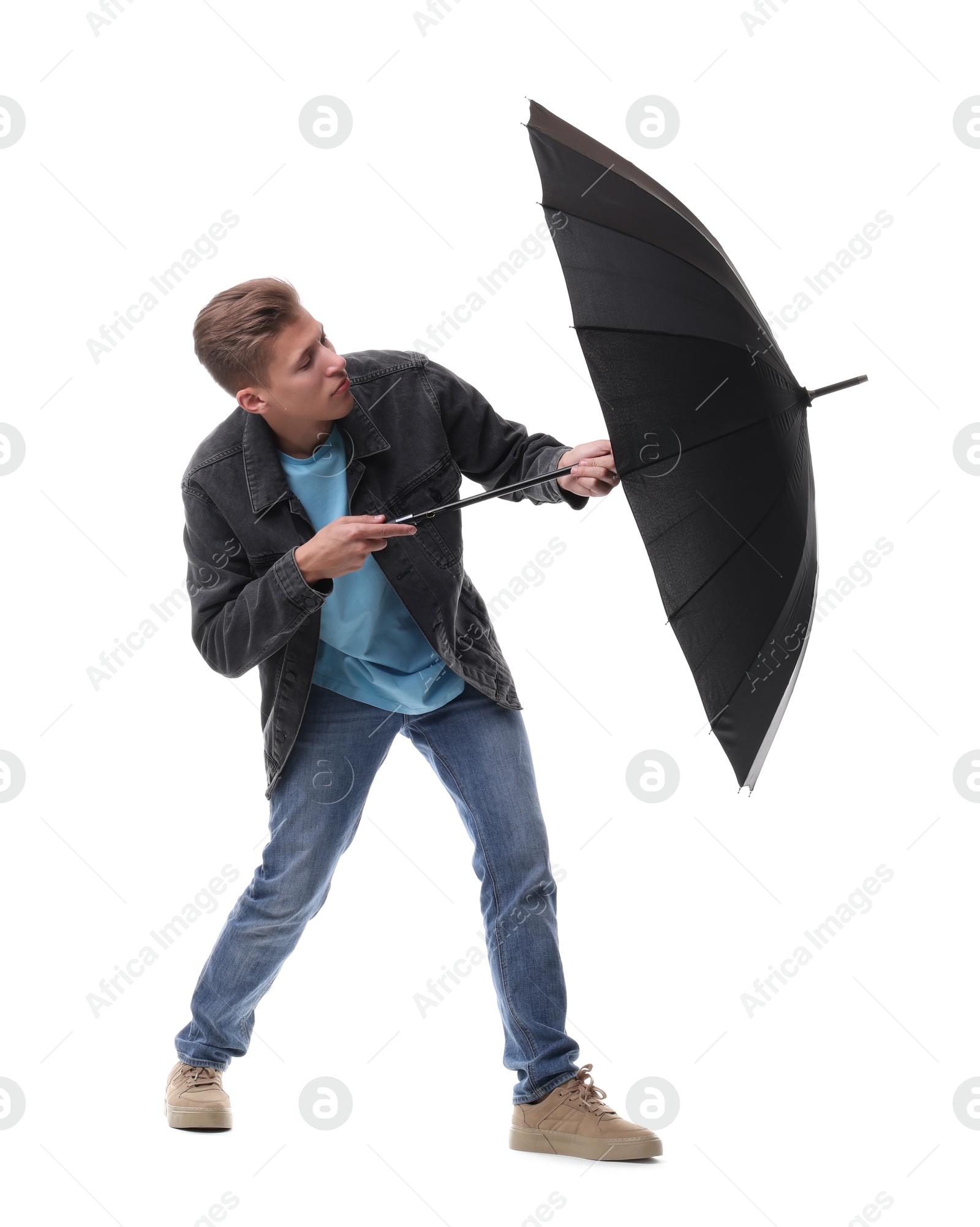 Photo of Man with black umbrella on white background