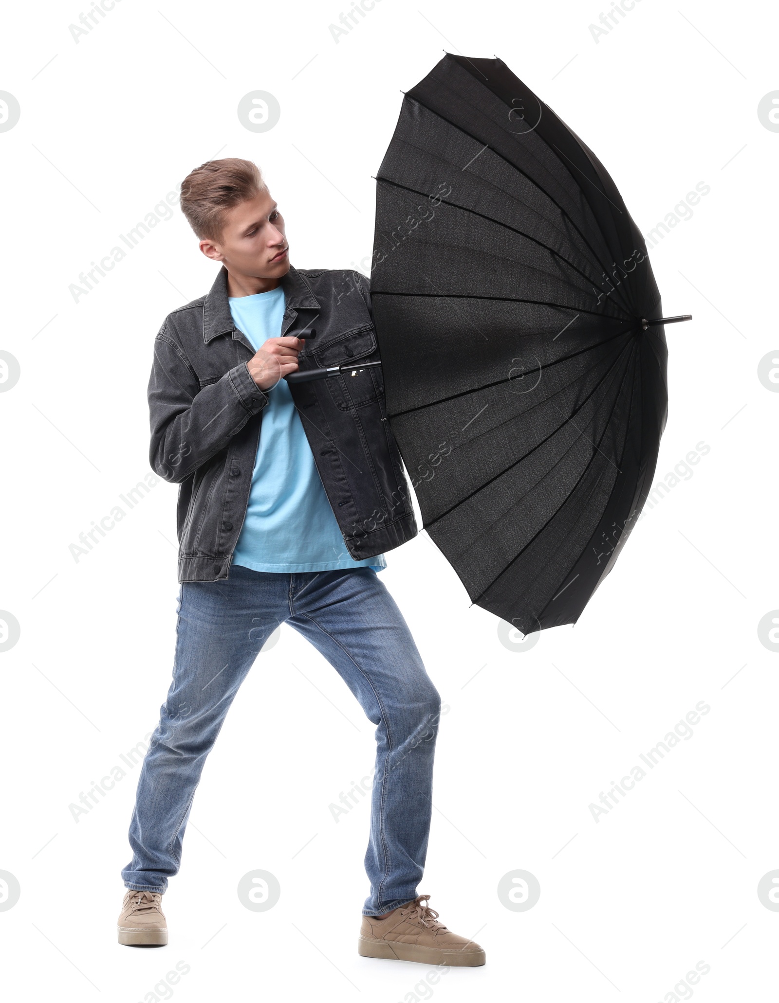 Photo of Man with black umbrella on white background