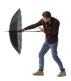 Photo of Man with black umbrella on white background