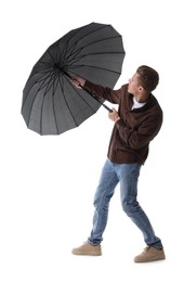 Man with black umbrella on white background