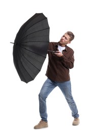 Photo of Man with black umbrella on white background