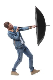 Photo of Man with black umbrella on white background