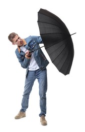 Photo of Man with black umbrella on white background