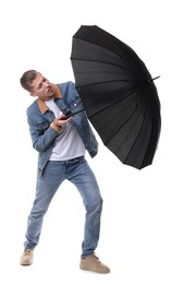 Man with black umbrella on white background