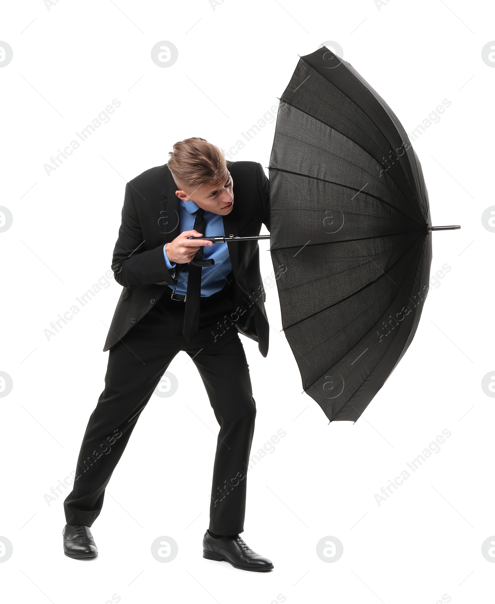 Photo of Man in suit with black umbrella on white background