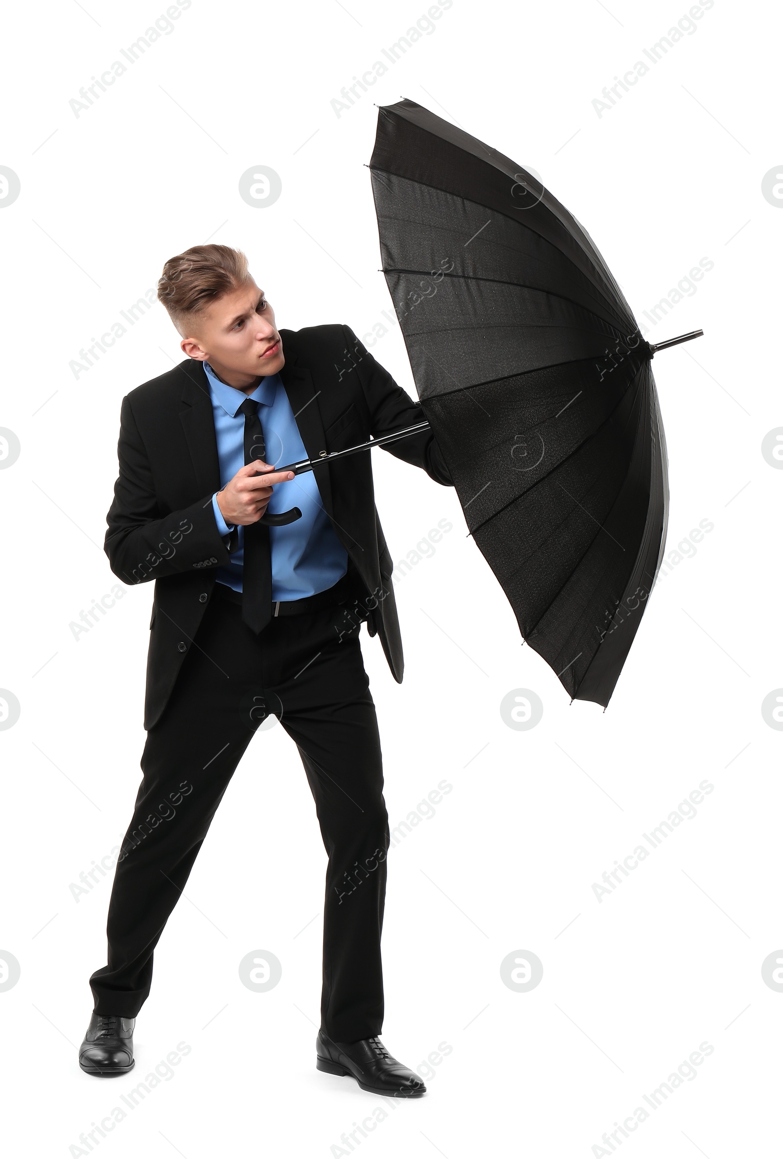 Photo of Man in suit with black umbrella on white background