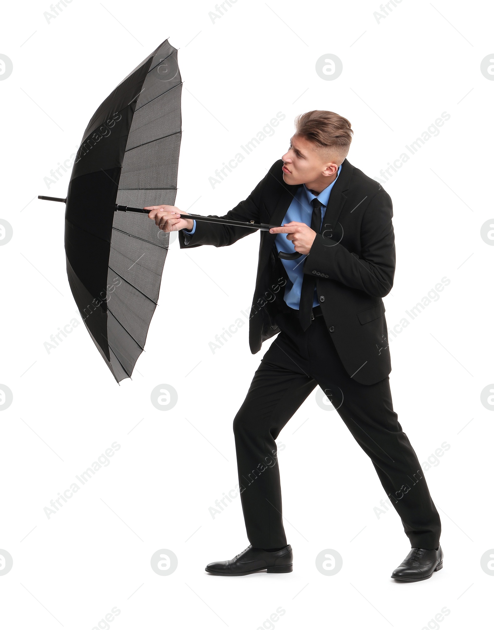 Photo of Man in suit with black umbrella on white background